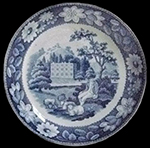 Pearlware teapot printed underglaze in medium blue.  Scene shows a shepherd and sheep in a country estate setting.   Continuous repeating floral border.  Transferware Collector’s Club named this pattern “Elegant Shepherd Boy”. 3.5” base diameter.